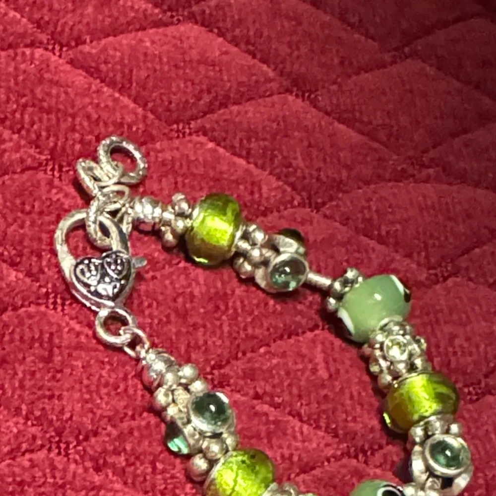 2 glass Bead and Elegant Silver Bracelets. In great condition.